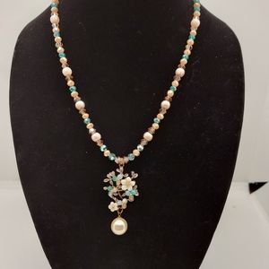 Glass beads with floral drop pendant